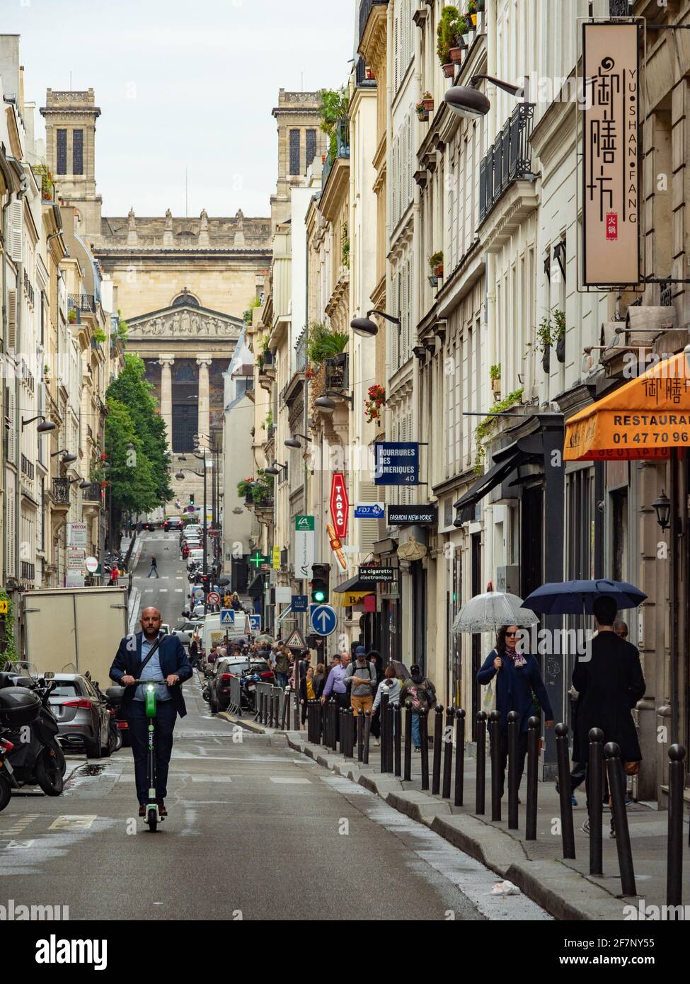 Paris, France - May 6th 2019: View along the lively Rue d'Hauteville Stock Photo