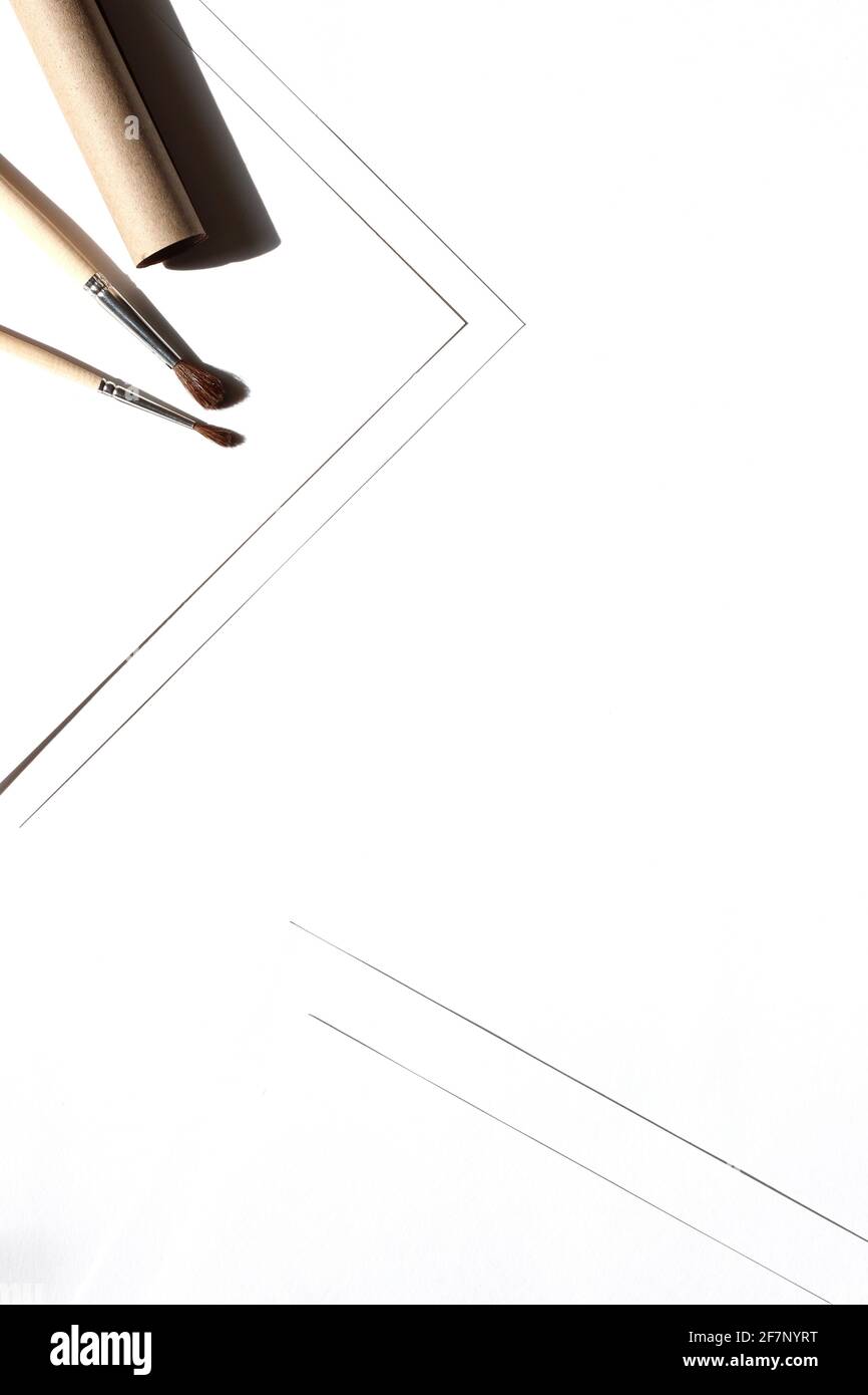 Minimal Design Flatlay with Kraft Paper and Brushes on White Background. Creative Art Design Mockup. Stock Photo