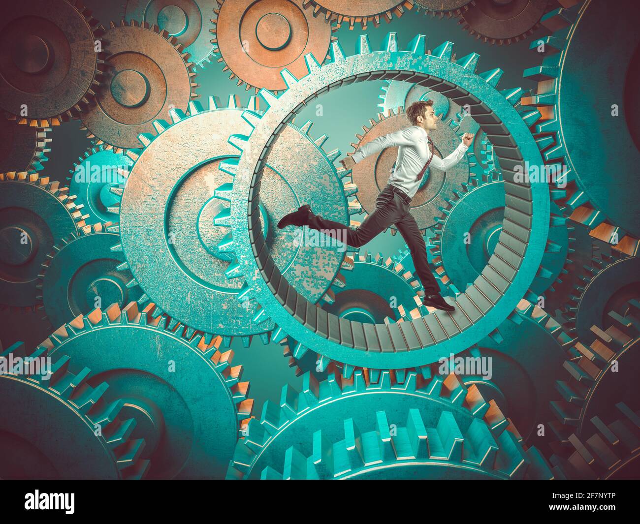 businessman runs into a wheel to make the gears move Stock Photo Alamy