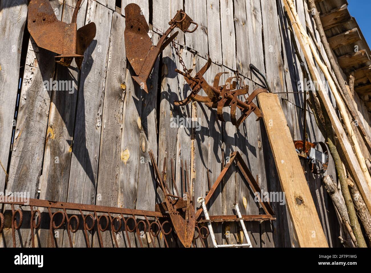 Lounge zone. Wooden lounge chair and table on lawn grass in a garden