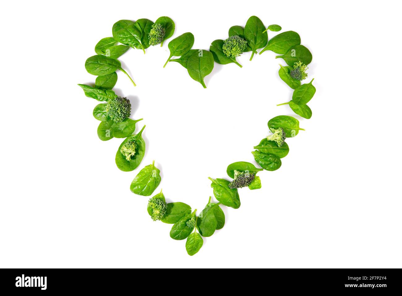 Heart Shape green Detox Salad and Vegetables isolated on white Background Stock Photo