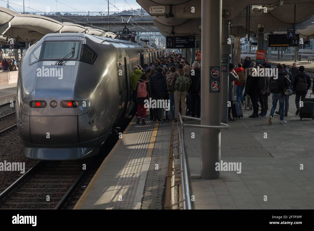 Passengers boarding the airport express train 