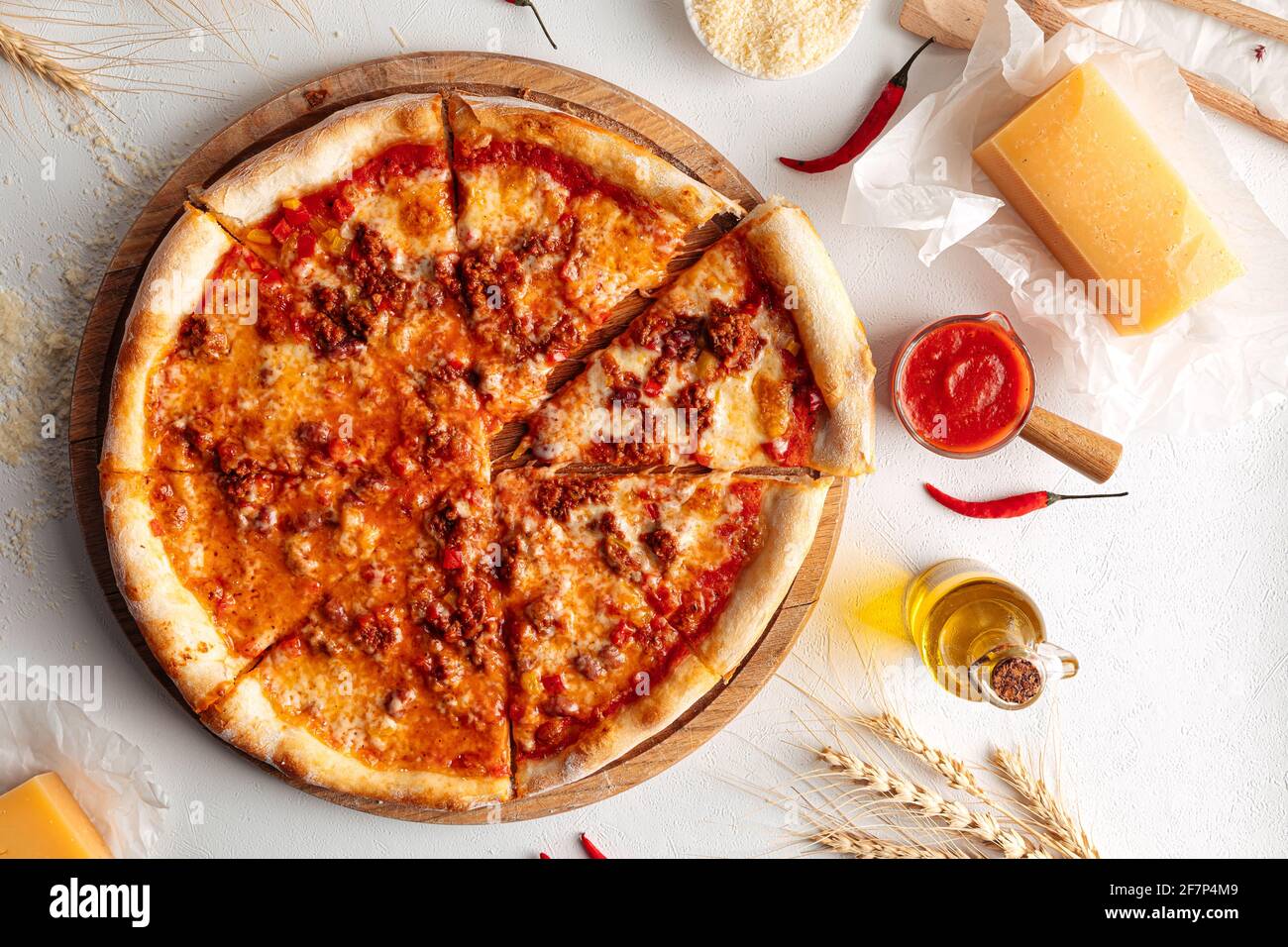 Sliced hot spicy pizza with minced meat Stock Photo