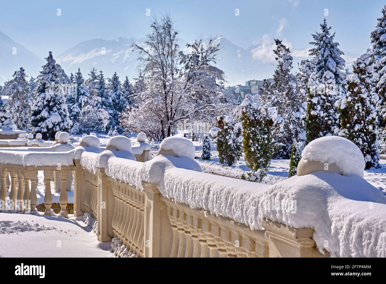 Freshly fallen snow on the decorative railing in the winter season ...