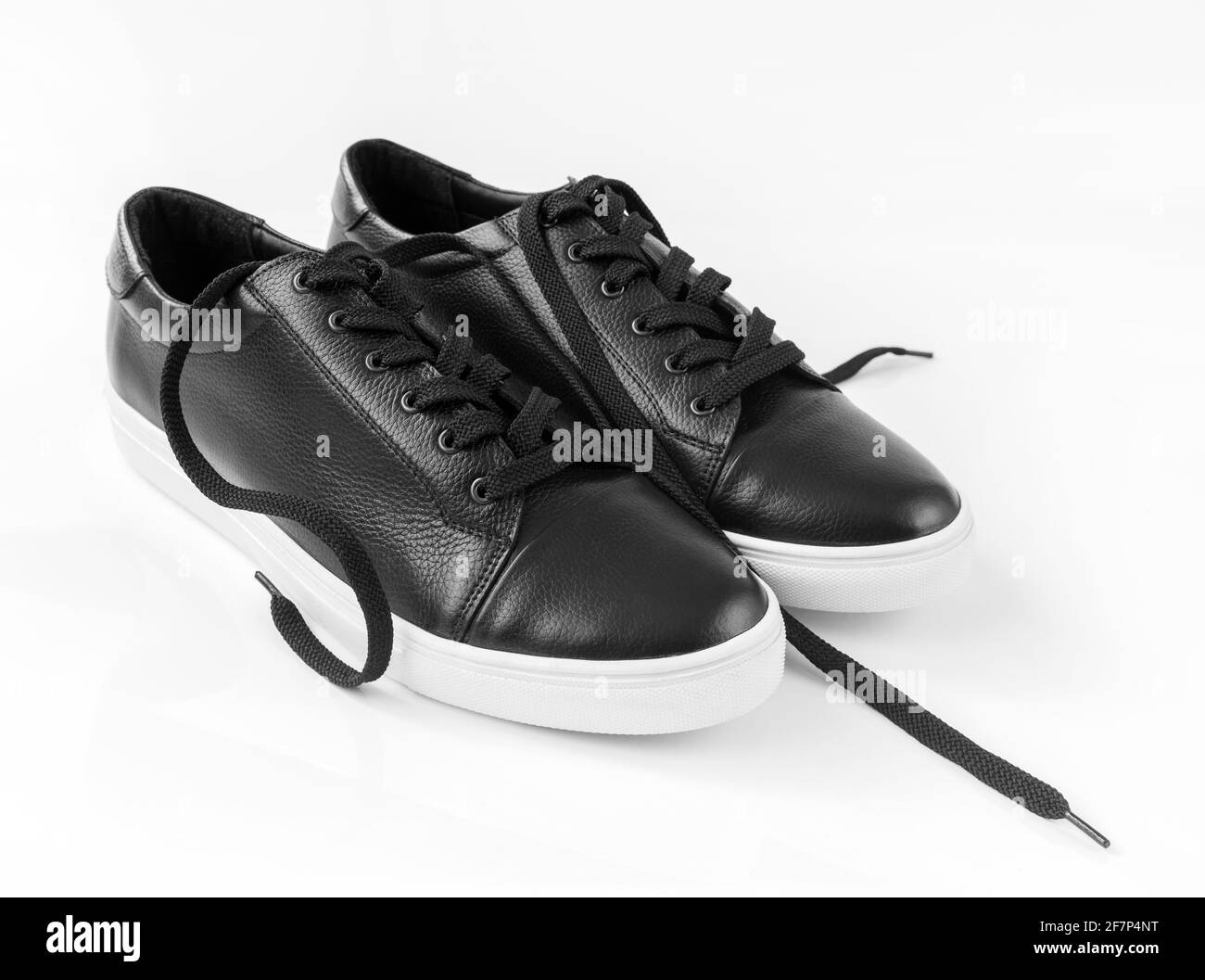 Black leather men's shoes on white background Stock Photo - Alamy