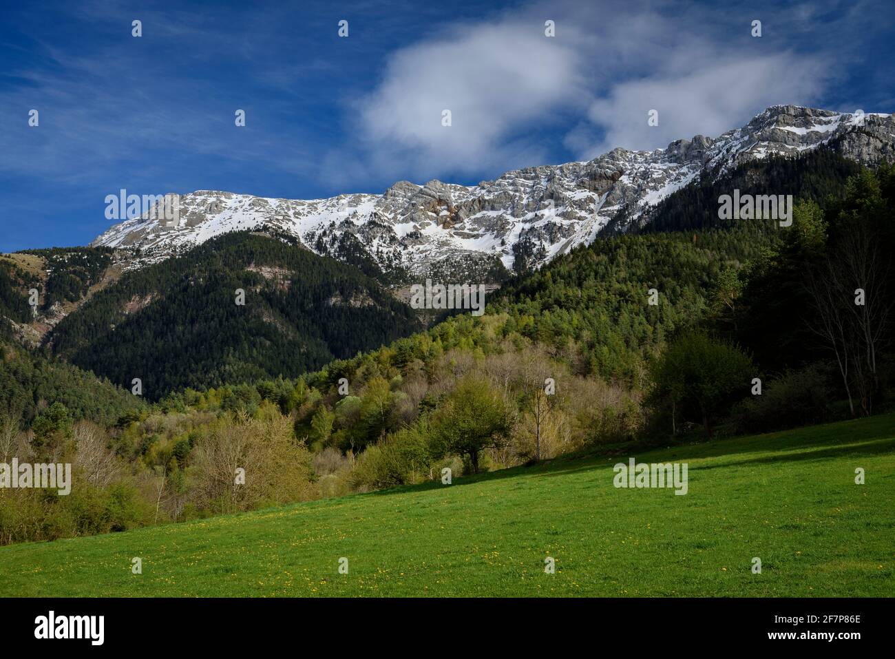 Bastanist Sanctuary in spring and the Serra del Cadí mountain range in the background (Cerdanya, Catalonia, Spain, Pyrenees) Stock Photo