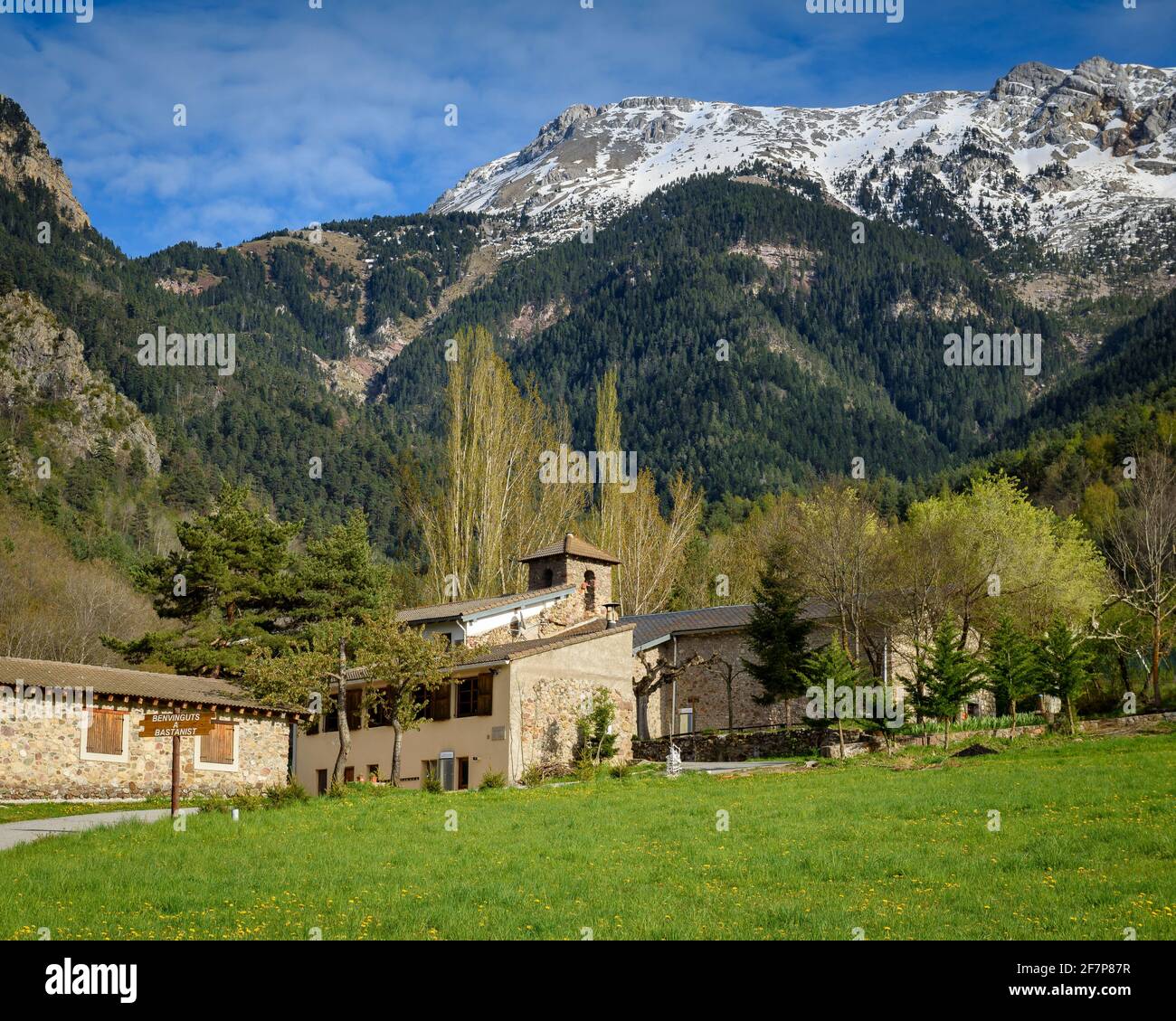 Bastanist Sanctuary in spring and the Serra del Cadí mountain range in the background (Cerdanya, Catalonia, Spain, Pyrenees) Stock Photo