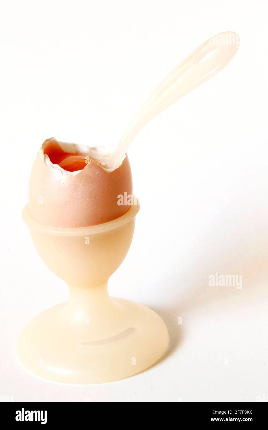 soft-boiled breakfast egg with an egg spoon in an egg cup Stock Photo