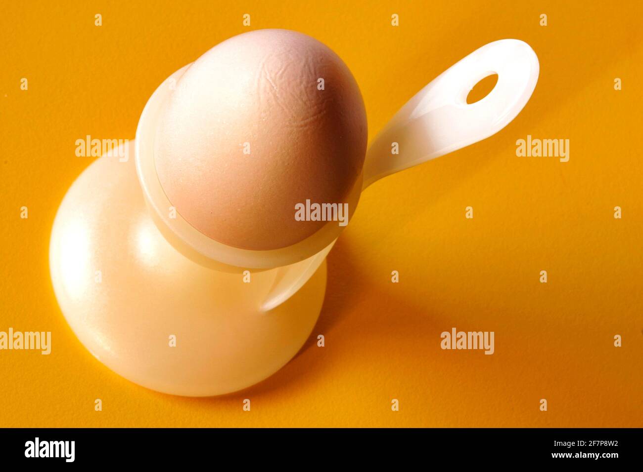 boiled breakfast egg with an egg spoon in an egg cup Stock Photo