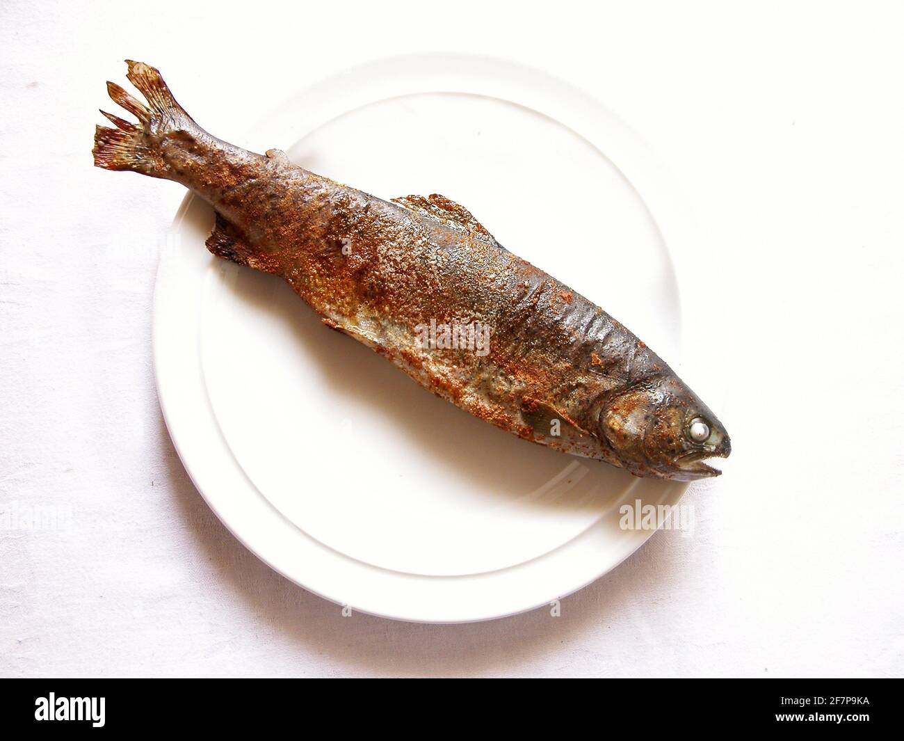 grilled trout on a plate Stock Photo Alamy