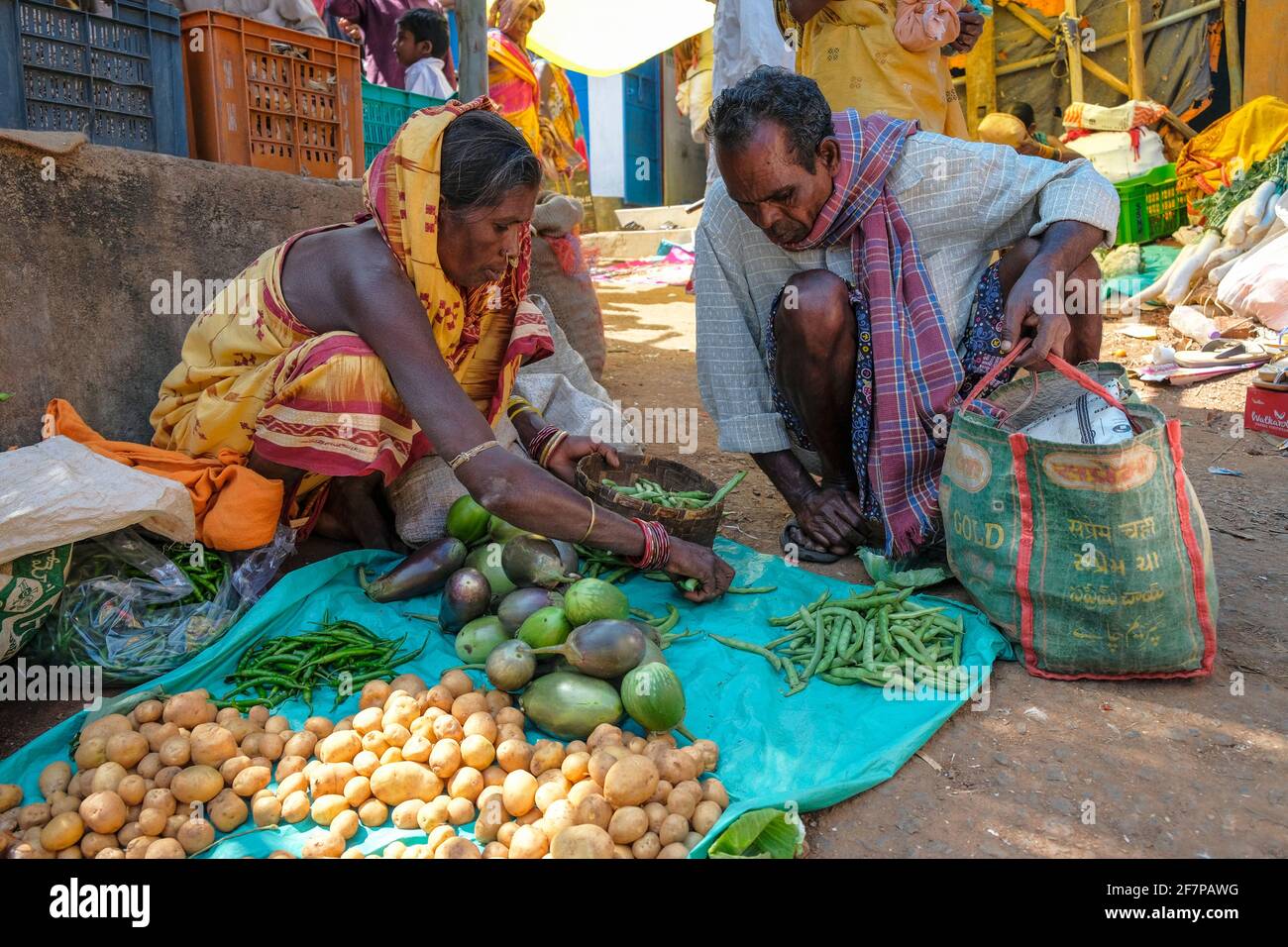 Koraput, India - February 2021: Adivasi woman from the Kondh tribe selling vegetables in the Koraput market on February 21, 2021 in Odisha, India. Stock Photo