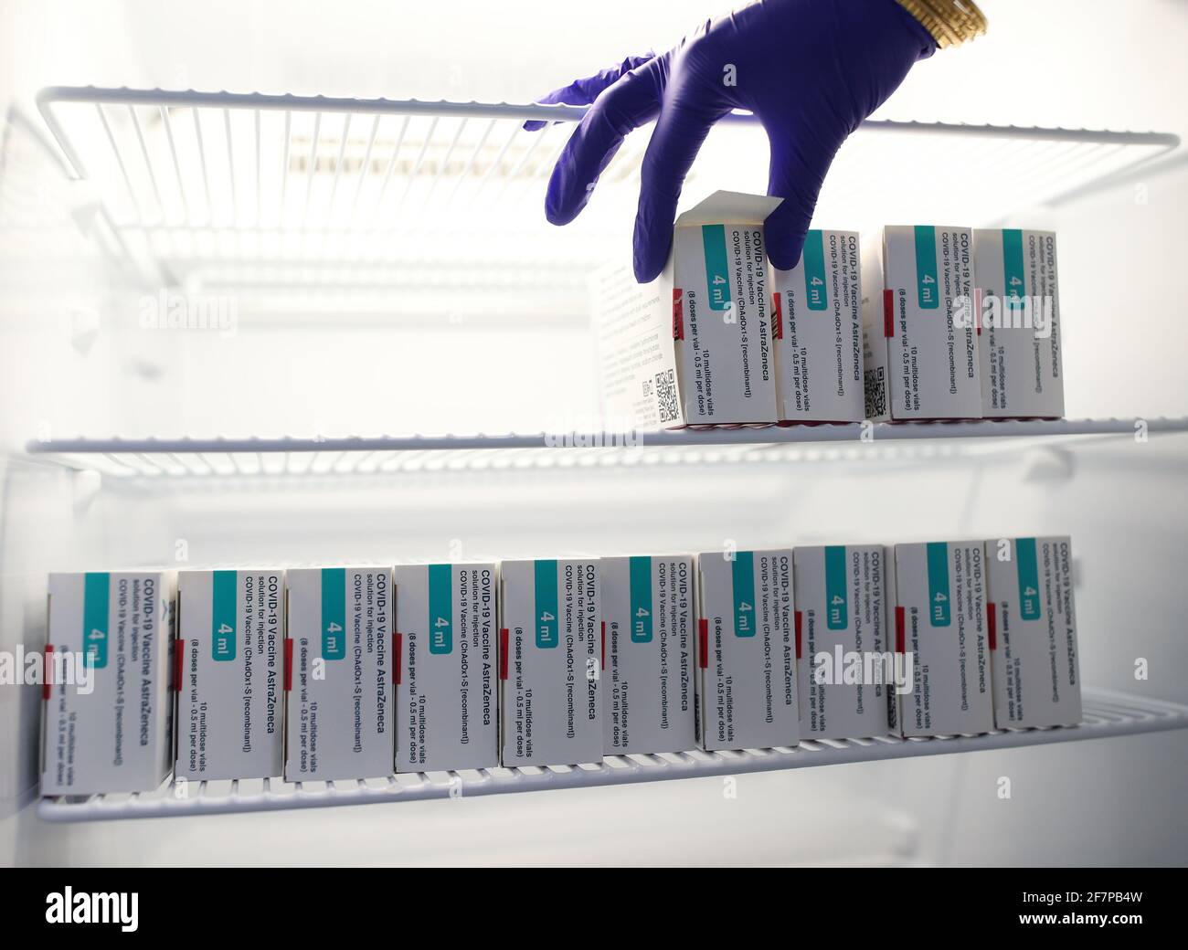 Vials of the Oxford/AstraZeneca coronavirus vaccine are stored in a temperature-controlled fridge, at Copes Pharmacy and Travel Clinic in Streatham, south London. Picture date: Friday April 9, 2021. Stock Photo