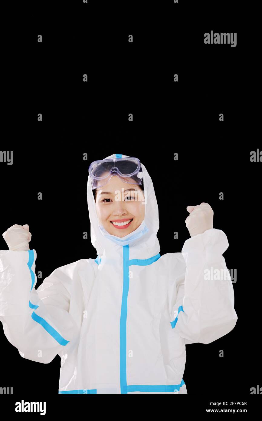 a Women doctor taking off masks celebrate Stock Photo