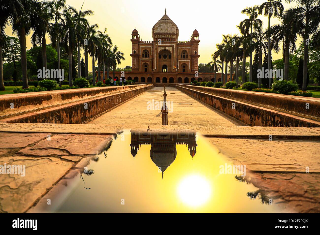 reflection of safdarjung tomb in mobile.it is a red sand stone marble monument in delhi,india. Stock Photo