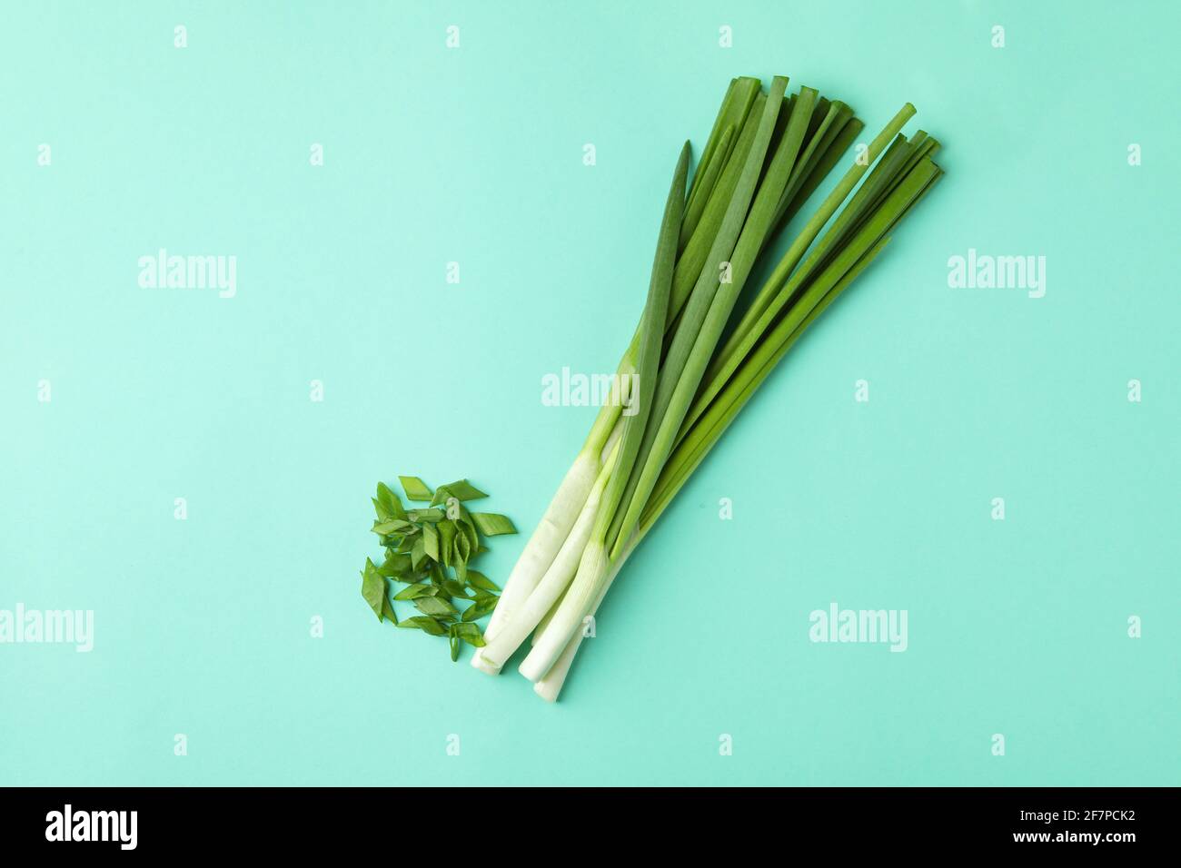 Bunch of green onion on mint background Stock Photo Alamy