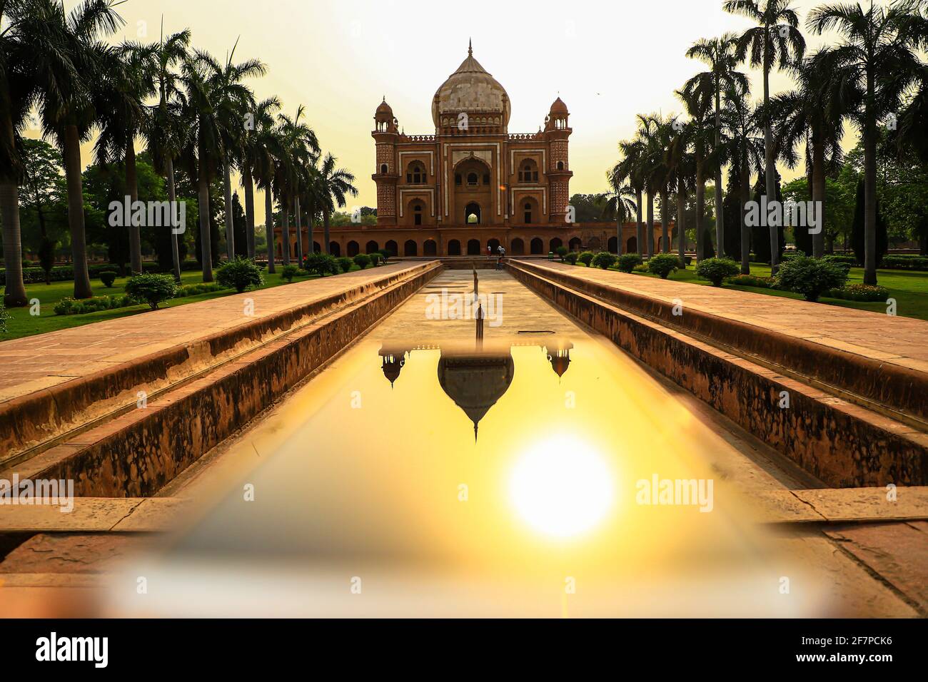 reflection of safdarjung tomb in mobile.it is a red sand stone marble monument in delhi,india. Stock Photo