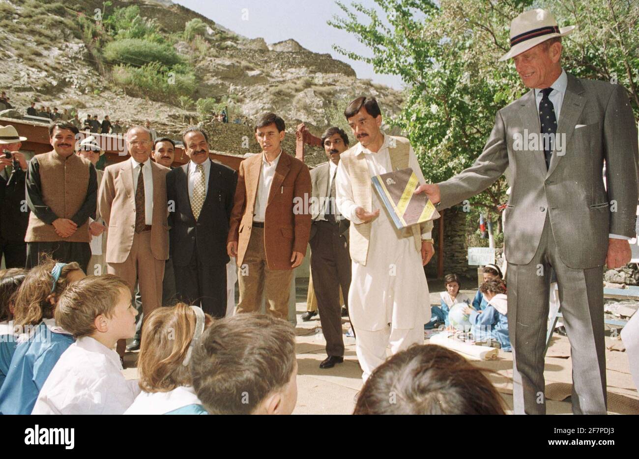 File photo dated 11/10/97 of the Duke of Edinburgh teaching English to Chitrali children at the Aga Khan School in Bilphok, North West Frontier Province in Pakistan. The Duke of Edinburgh has died, Buckingham Palace has announced. Issue date: Friday April 9, 2020.. See PA story DEATH Philip. Photo credit should read: John Stillwell/PA Wire Stock Photo
