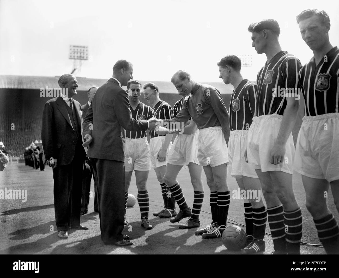 File photo dated 05/05/56 of The Duke of Edinburgh shaking hands with  Manchester City's Footballer of the Year Bert Trautmann, before the FA Cup  final at Wembley in London. The Duke of