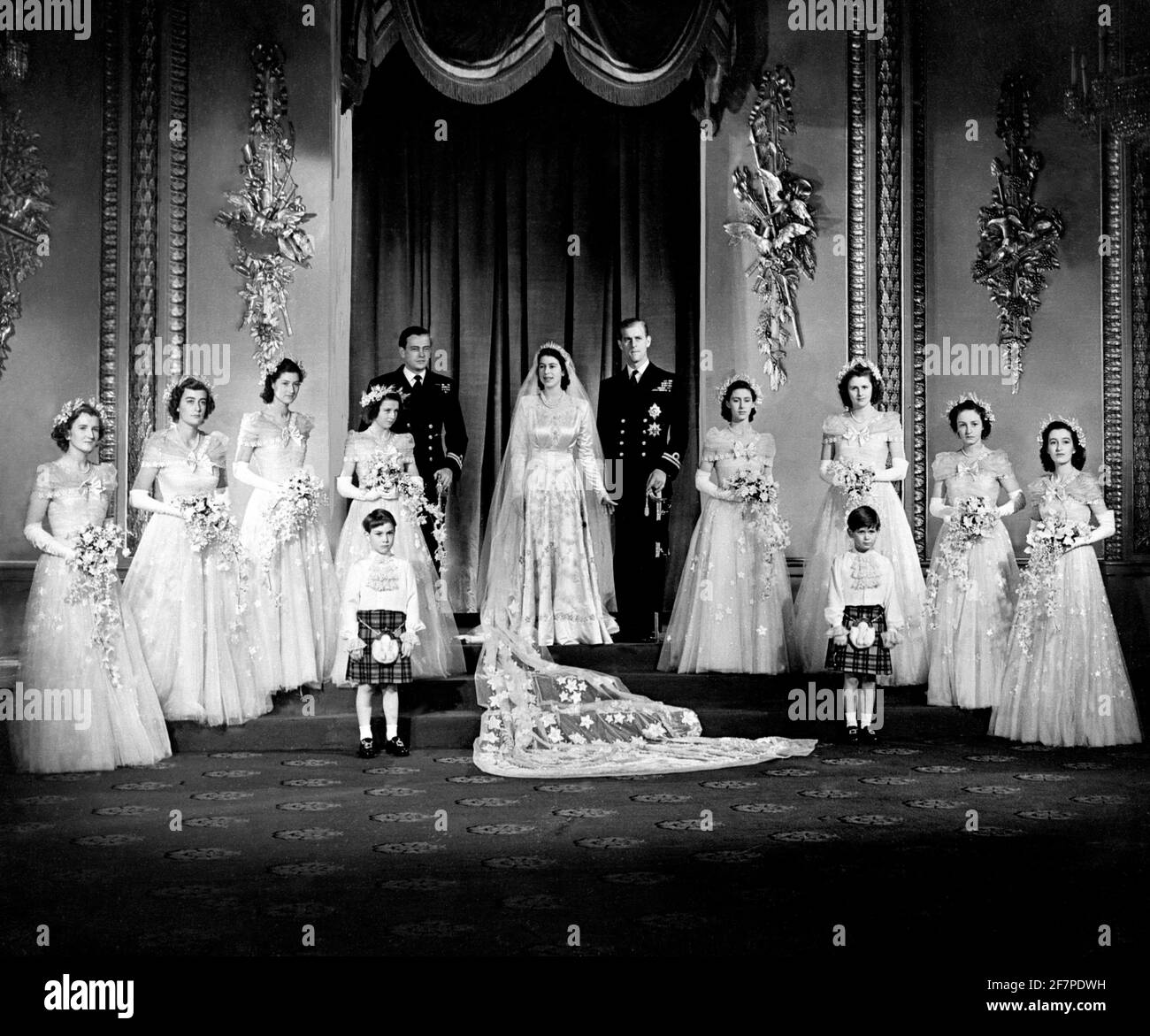 File photo dated 20/11/47 of the Duke of Edinburgh and Queen Elizabeth II with their bridesmaids (left to right) The Hon. Margaret Elphinstone, The Hon. Pamela Mountbatten, Lady Mary Cambridge, Princess Alexandra of Kent, Princess Margaret, Lady Caroline Montagu-Douglas-Scott, Lady Elizabeth Lambart and The Hon. Diana Bowes-Lyon in the Throne Room at Buckingham Palace immediately after their wedding ceremony. The Duke of Edinburgh has died, Buckingham Palace has announced. Issue date: Friday April 9, 2020.. See PA story DEATH Philip. Photo credit should read: PA/PA Wire Stock Photo