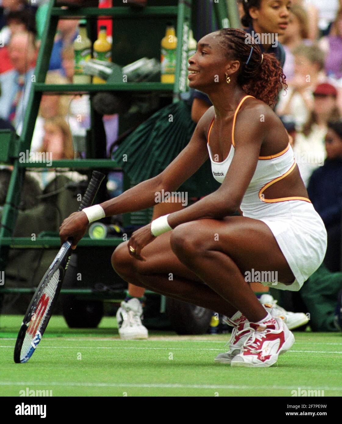 Venus Williams  in action against Martina Hingis July 2000in their quarter final match at Wimbledon . Williams won  in three sets Stock Photo