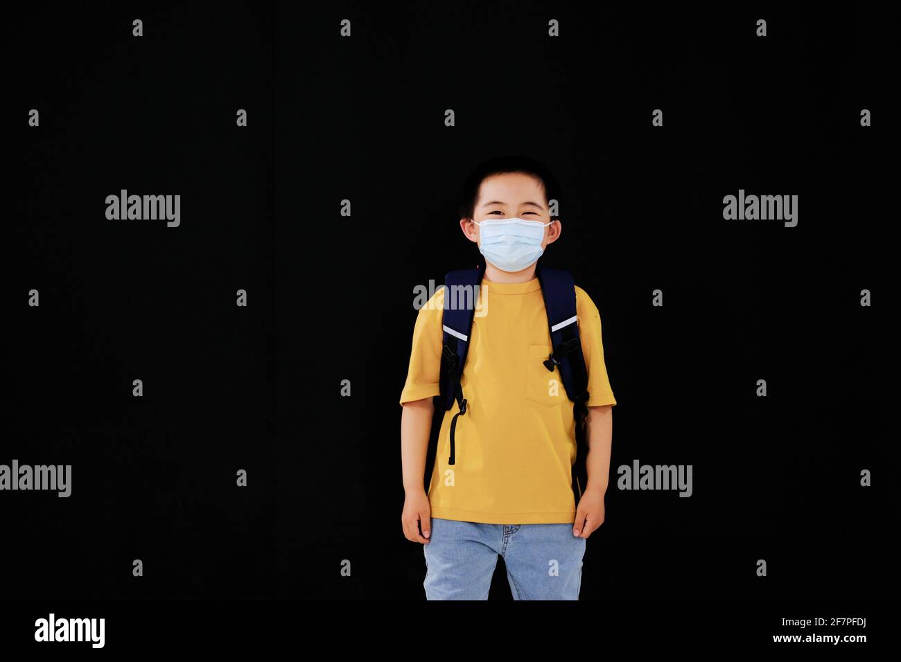 The little boy with mask goes to school standing Stock Photo Alamy