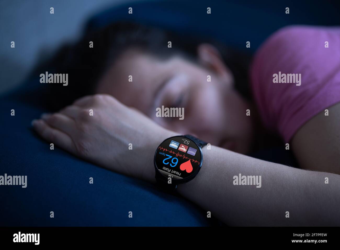 Wearable Sleep Tracking Heart Rate Monitor Smartwatch In Bed Stock Photo