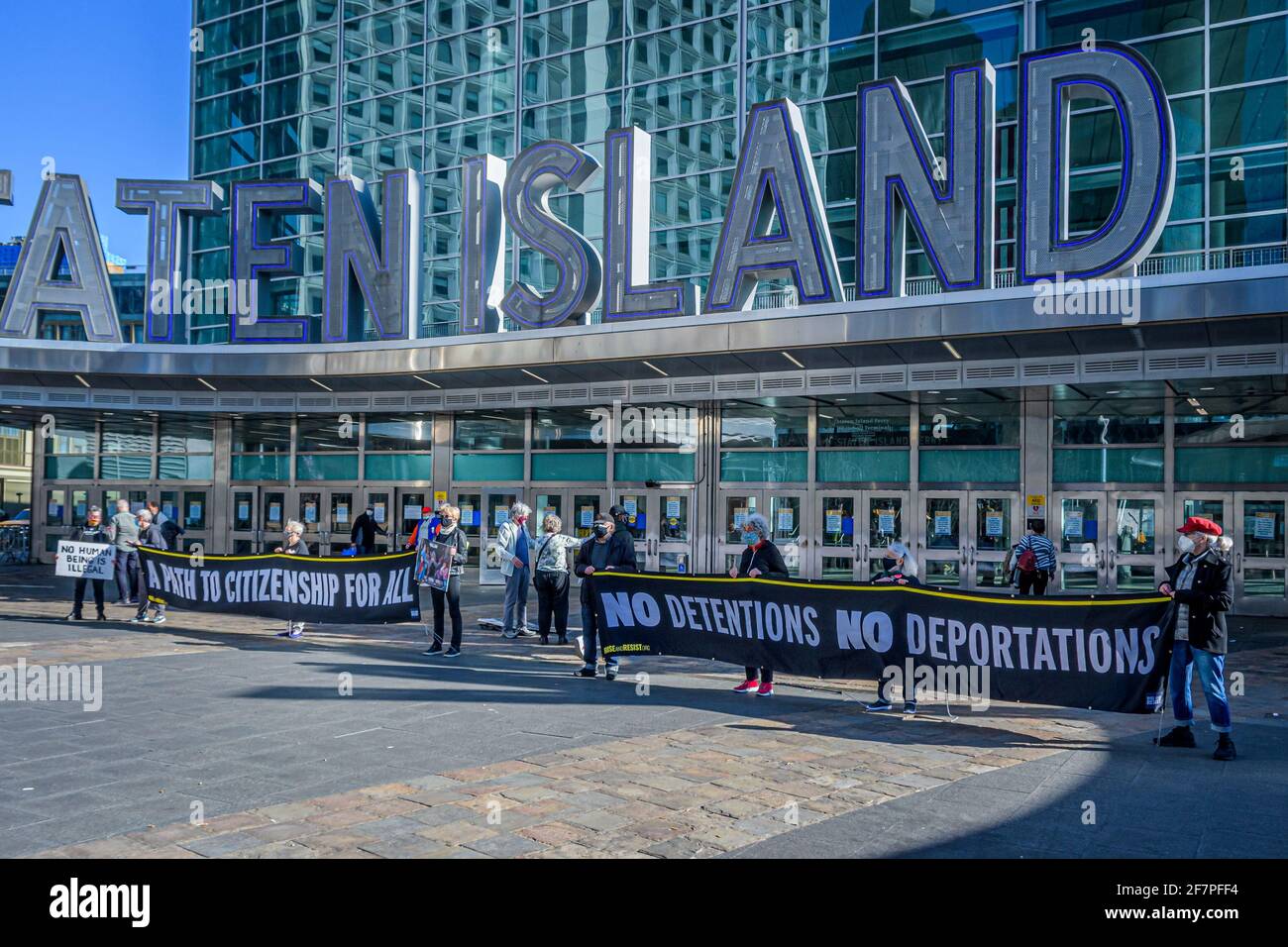 Members of the activist group Rise and Resist gathered at the plaza outside the Staten Island Ferry in Manhattan on April 8, 2021 to continue their weekly Immigration Vigils demanding that the Biden administration permanently stop detaining and deporting immigrants, to dismantle CBP (Customs and Border Patrol) and ICE (Immigration and Customs Enforcement), and to create a path to citizenship for all. (Photo by Erik McGregor/Sipa USA) Stock Photo