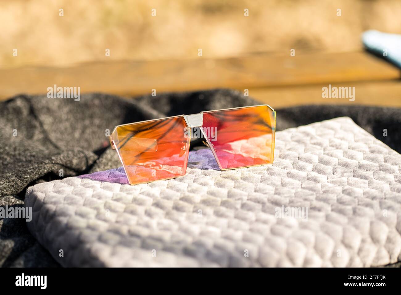 Oversized sunglasses model with big flat lenses shoot outside in a sunny day closeup . Selective focus Stock Photo
