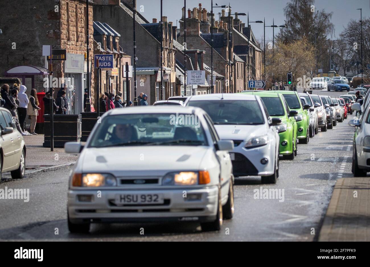 The funeral cortege of Craig Melville passes along the High Street in