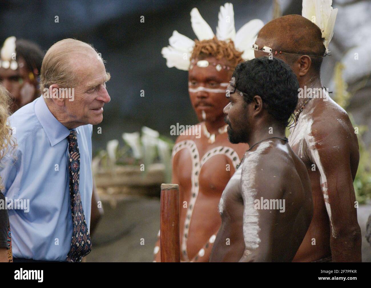 File photo dated 01/03/02 of The Duke of Edinburgh talking to Aboriginal performers after watching a culture show at Tjapukai Aboriginal Culture Park, Cairns, Queensland, Australia. The Duke surprised the aborigines when he asked them 'Do you still throw spears at each other?'. The Duke of Edinburgh was perhaps best known for his gaffes. He shocked and sometimes delighted the public with his outspoken remarks and clangers. Issue date: Friday April 4, 2021. Stock Photo