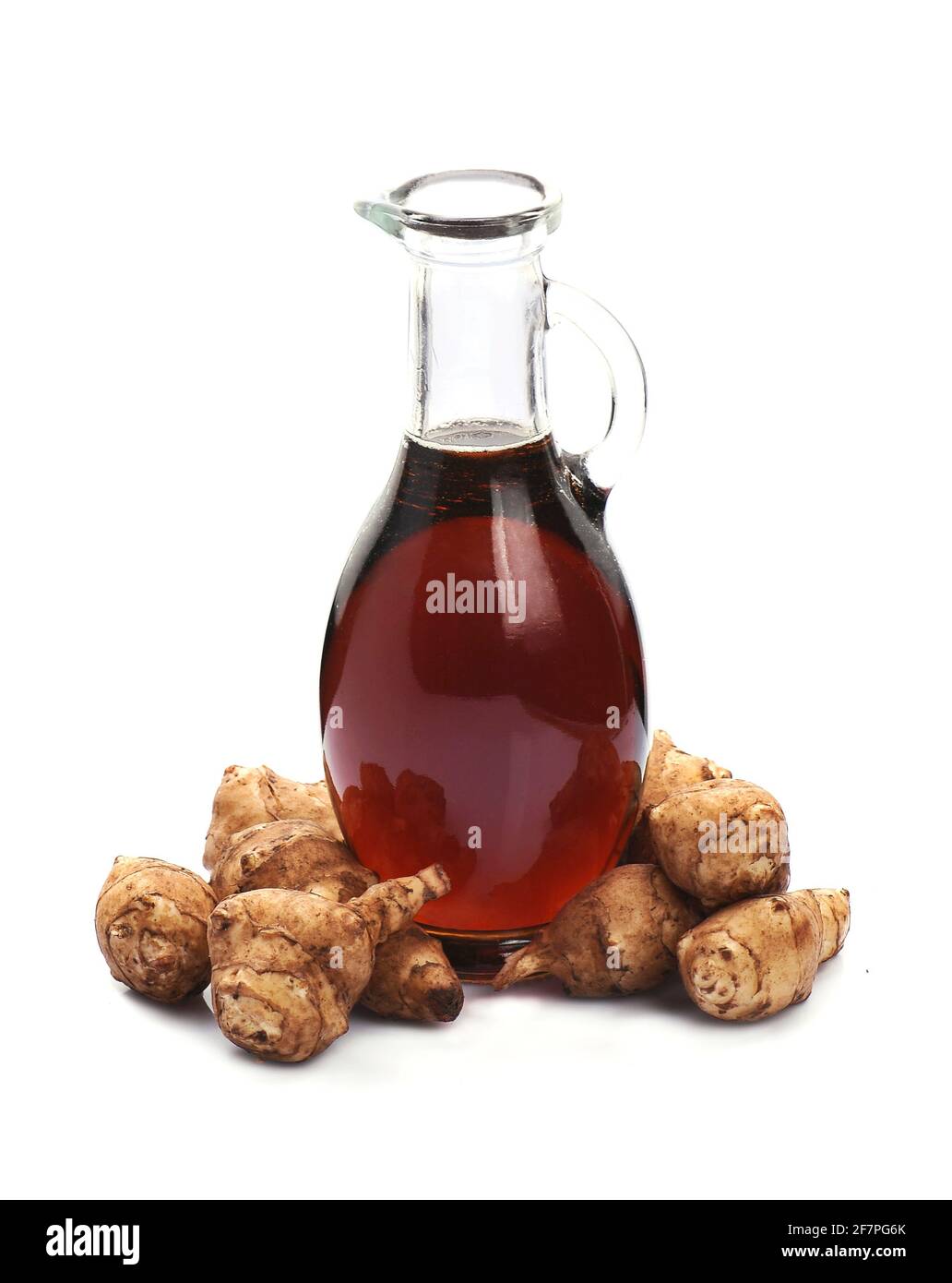 Jerusalem artichoke syrup with jerusalem root on white backgrounds