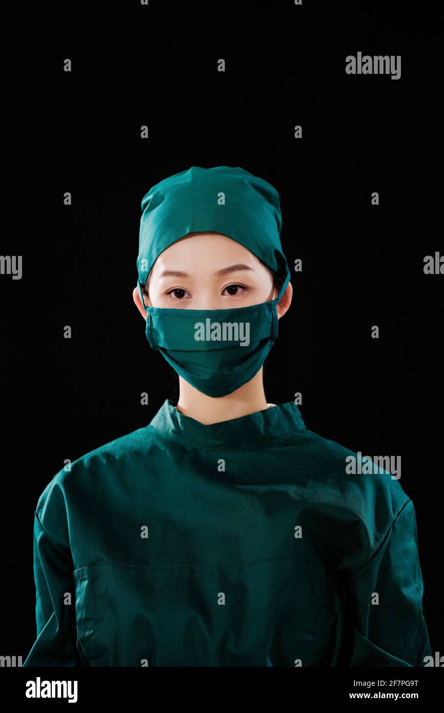 Portrait of a young female surgeon looking at the camera Stock Photo