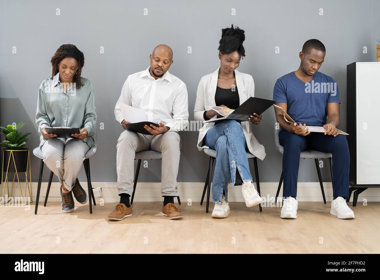 African American Unemployed Job Applicants Waiting In Line Stock Photo