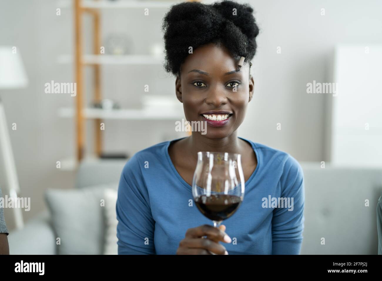 Woman Drinking Red Wine In Video Conference At Home Stock Photo - Alamy
