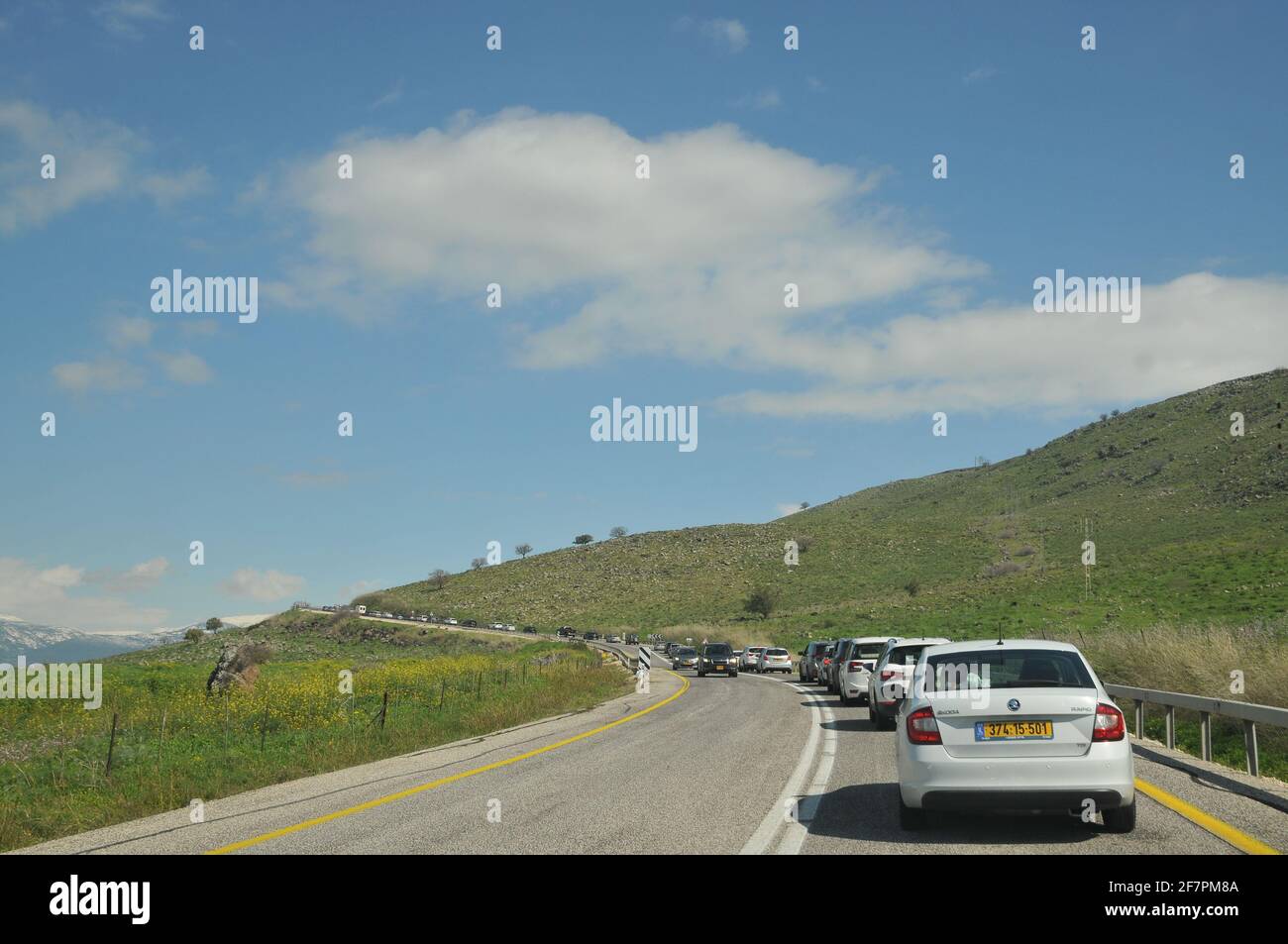 Excessive heavy traffic on a narrow road leading to place of Interest (Mount Hermon). Photographed on a Sunny winter day, Golan Heights, Israel Stock Photo