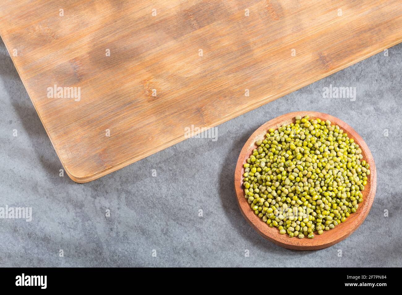 Mung beans in the wooden bowl - Vigna radiata Stock Photo