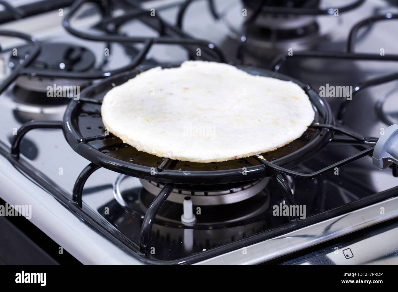 Colombian arepa on the grill - Traditional colombian food Stock