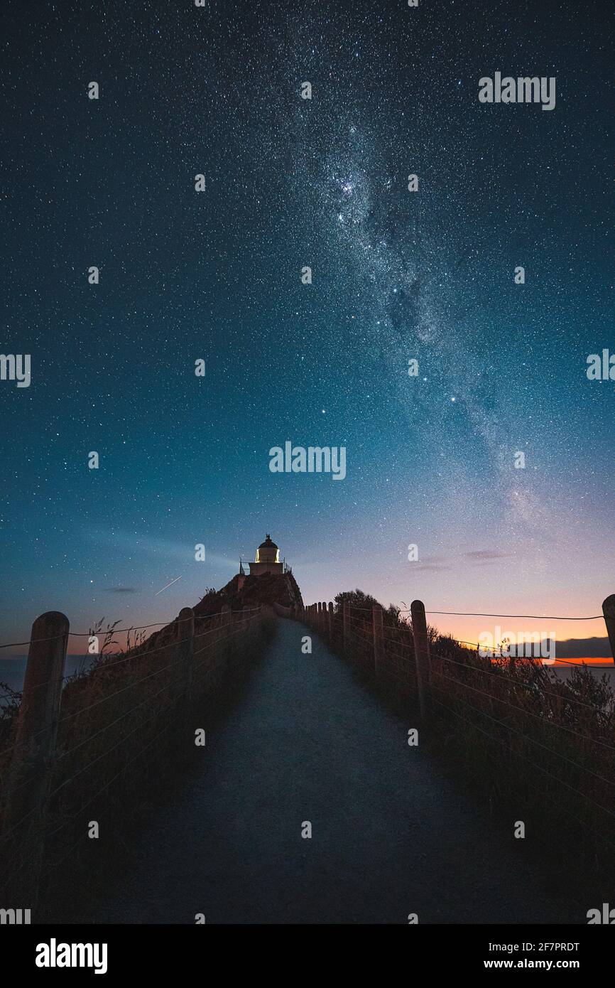 Beautiful sunrise at Nugget Point Lighthouse, New Zealand Stock Photo