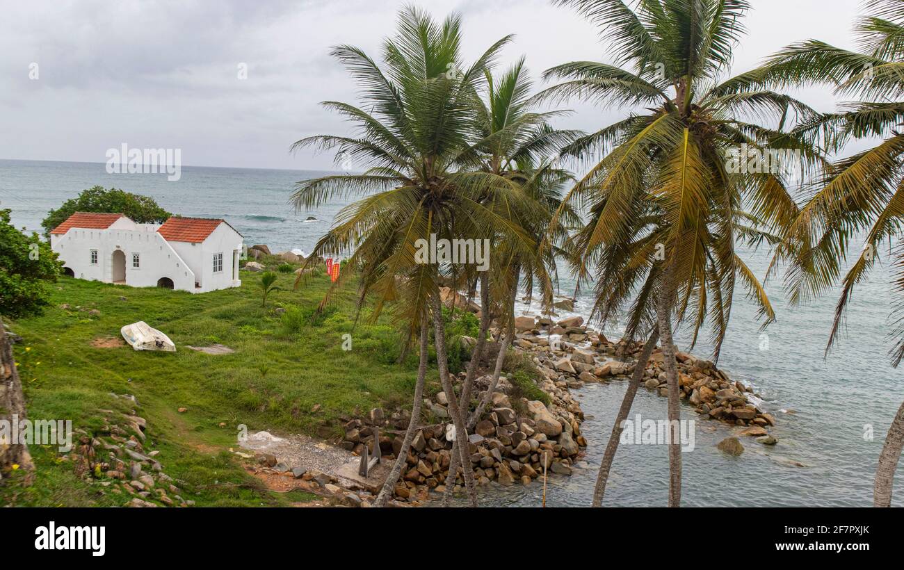 A colonial era house outside a fort overlooking the ocean in Dixcove, Ghana. Stock Photo