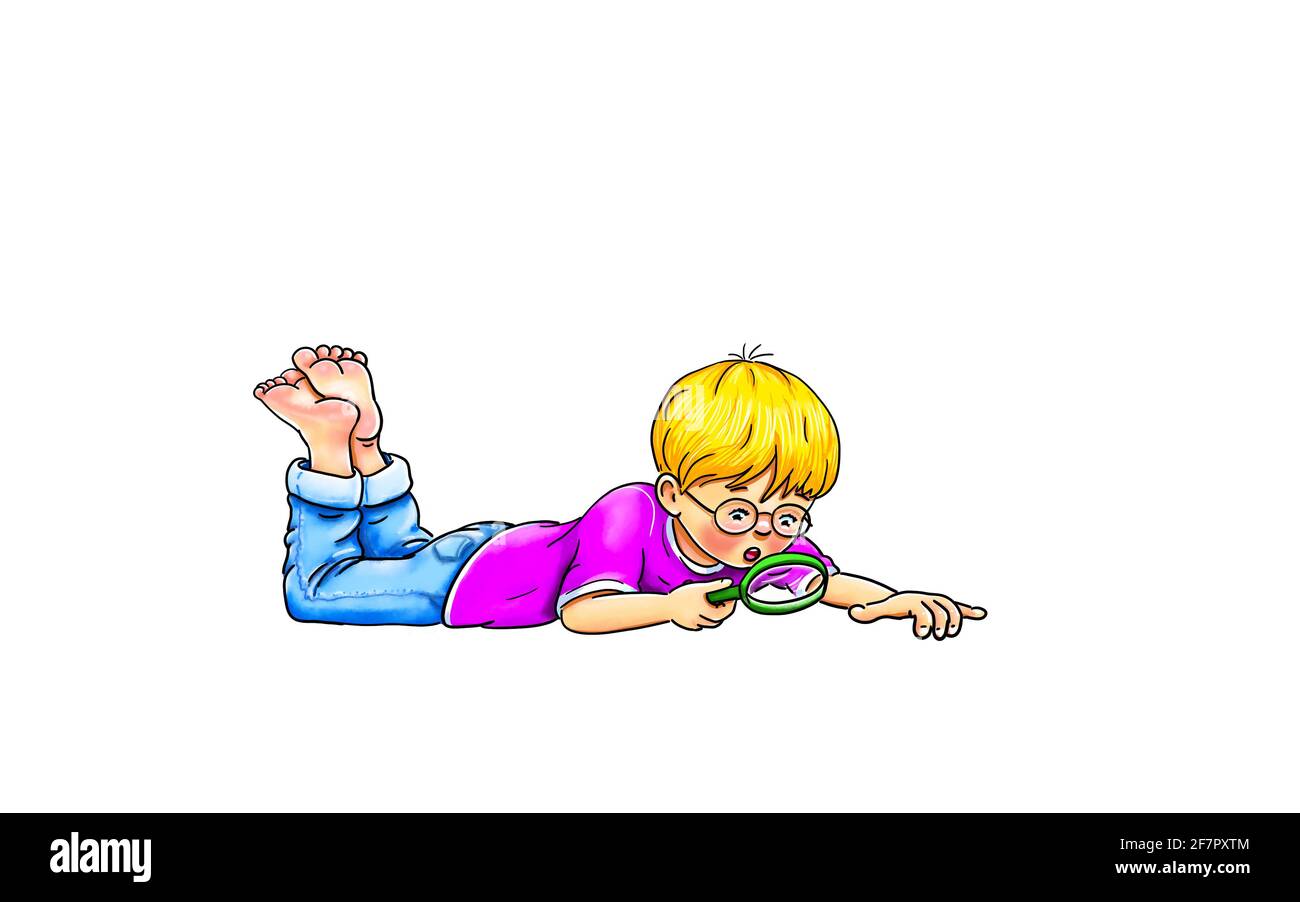 little boy with glasses lies on the floor and looks at something