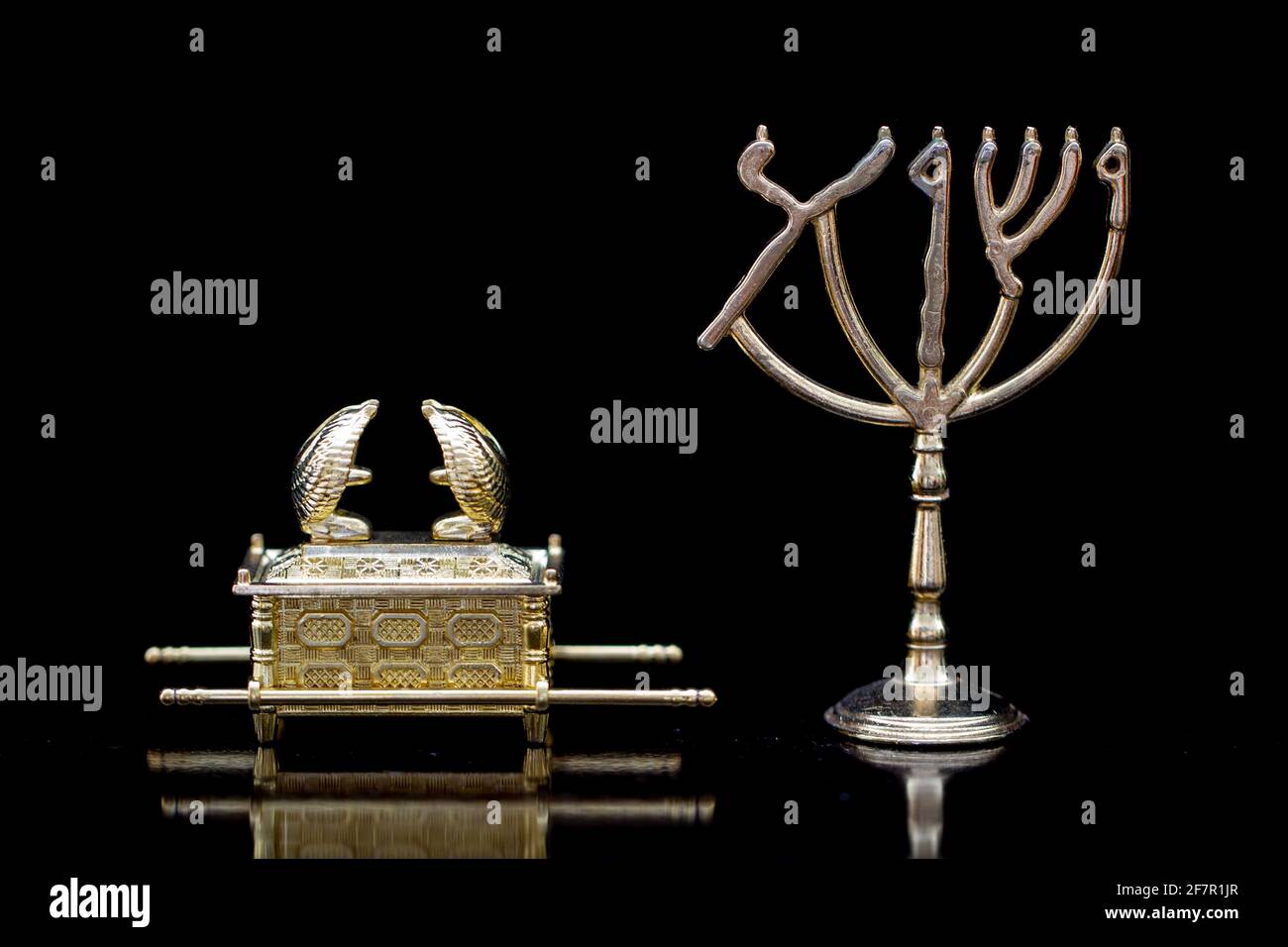 Jewish Menorah and Ark of Covenant 31Make a lampstand of pure gold. Hammer out its base and shaft, and make its flowerlike cups, buds and blossom. Stock Photo