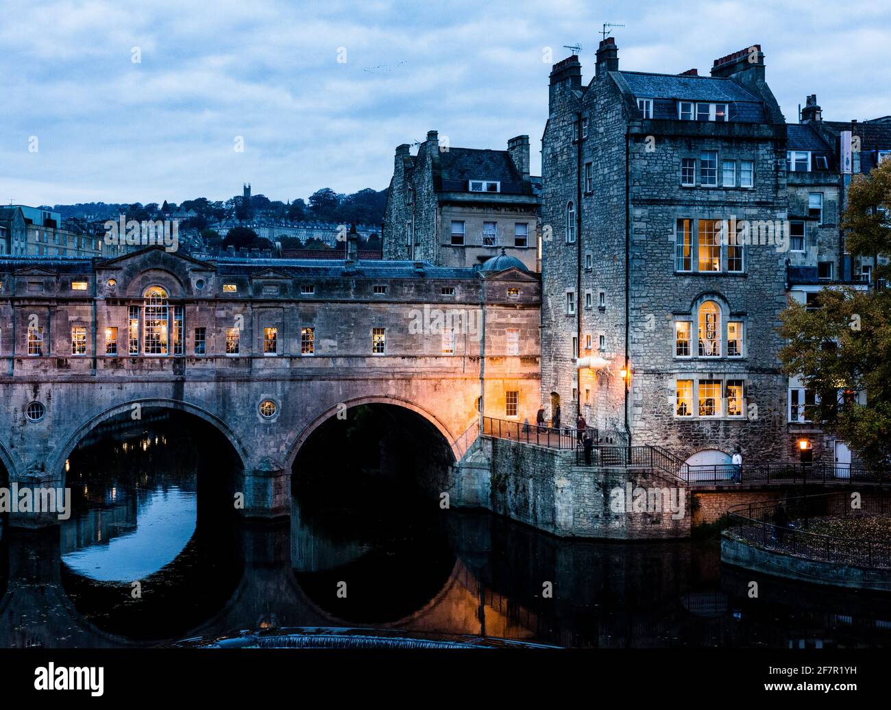 Evening Scene Of Pulteney Bridge In Bath City Centre With River evening-scene-of-pulteney-bridge-in-bath-city-centre-with-river