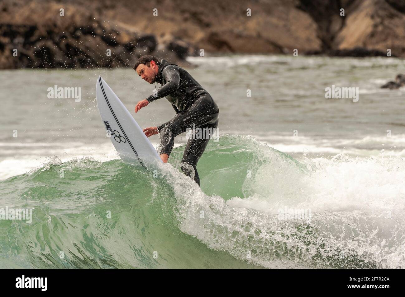 Long Strand, West Cork, Ireland. 9th Apr, 2021. Ardfield based surfer Dylan Buckley took the chance to catch a few waves today at Long Strand Beach, near Owenahincha, on a warm but overcast afternoon. Credit: AG News/Alamy Live News Stock Photo