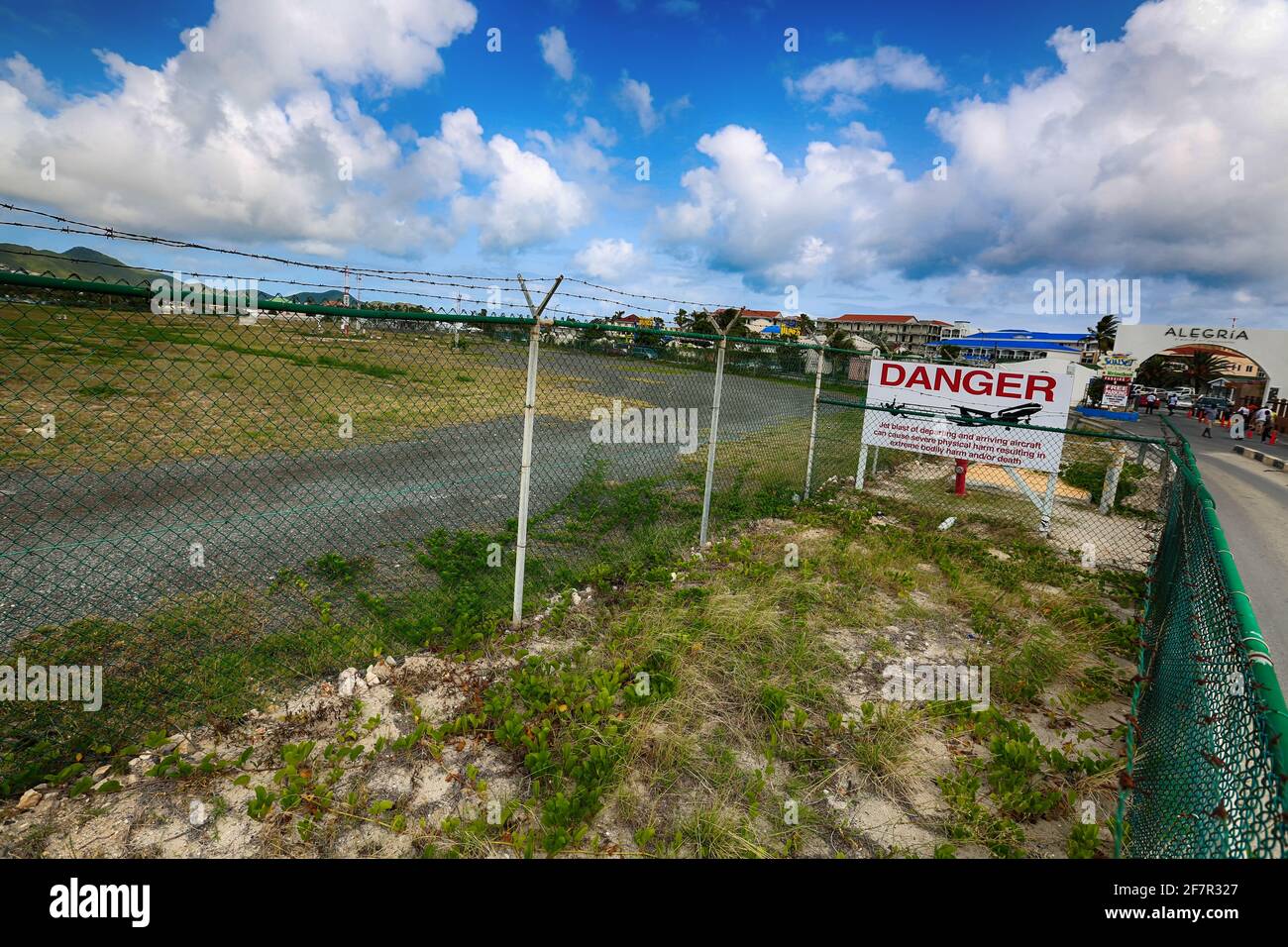 Beach spectator jet blast warning sign at the Maho Beach end of Juliana International Airport runway St Maarten Stock Photo