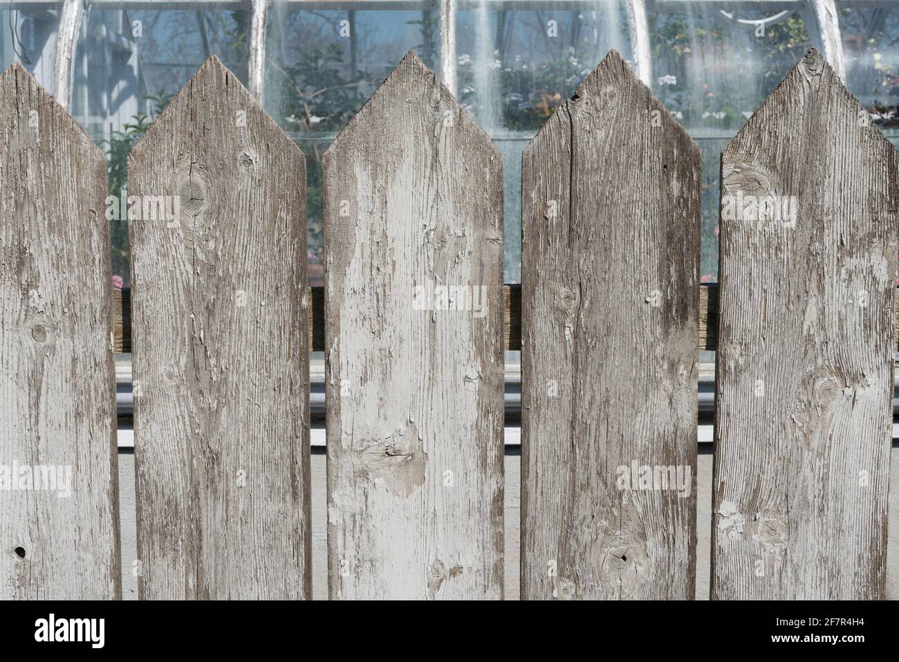 weathered white picket fence close up Stock Photo