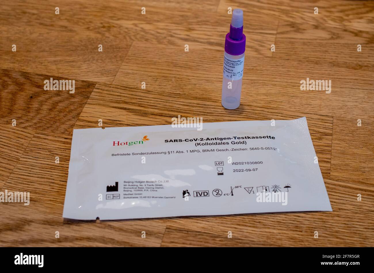 BAMBERG, GERMANY - 8.4.2021. Covid-19 antigen saliva test Kit with plastic specimen for a rapid coronavirus check from Hotgen. Stock Photo