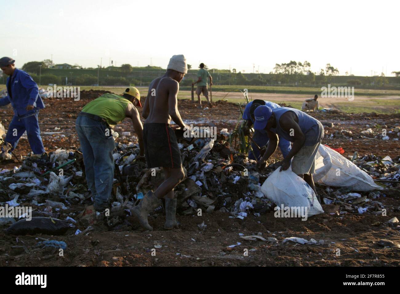 salvador, bahia / brazil july 28, 2006 recyclable waste pickers are seen turning over garbage