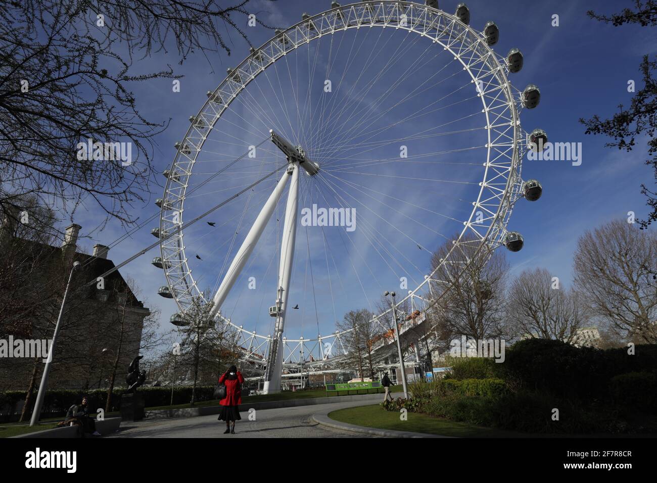 London, Britain. 9th Apr, 2021. People walk past the London Eye in London, Britain, on April 9, 2021. COVID-19 deaths in Europe surpassed the one million mark on Friday, reaching 1,001,313, according to the dashboard of the World Health Organization's Regional Office for Europe. Credit: Tim Ireland/Xinhua/Alamy Live News Stock Photo