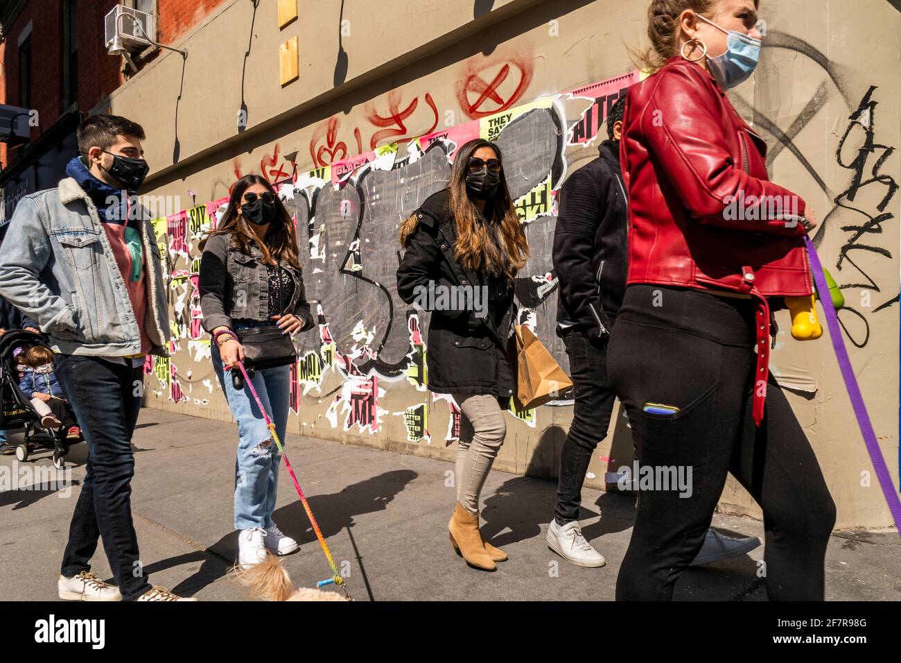 Pedestrians pass by the closed Grom gelato store on Bleecker Street in Greenwich Village in New York on Saturday, April 3, 2021. (© Richard B. Levine) Stock Photo