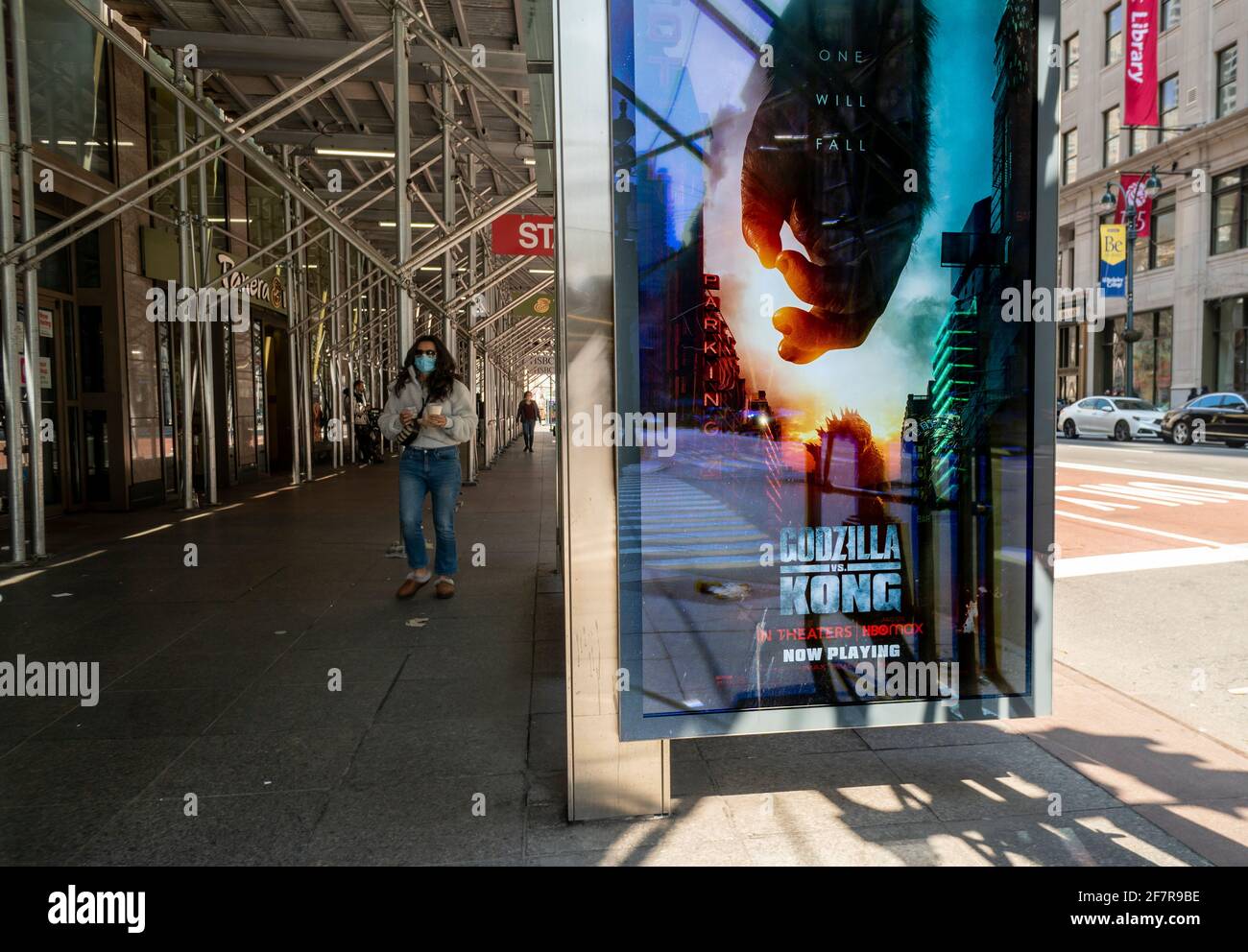 The newly released ÒGodzilla vs. KongÓ film is seen advertised on a bus shelter kiosk in New York on Sunday, April 4, 2021. The film released by Warner Bros., grossed $48.5 million over its five-day holiday weekend release greatly exceeding analystsÕ predictions. (© Richard B. Levine) Stock Photo